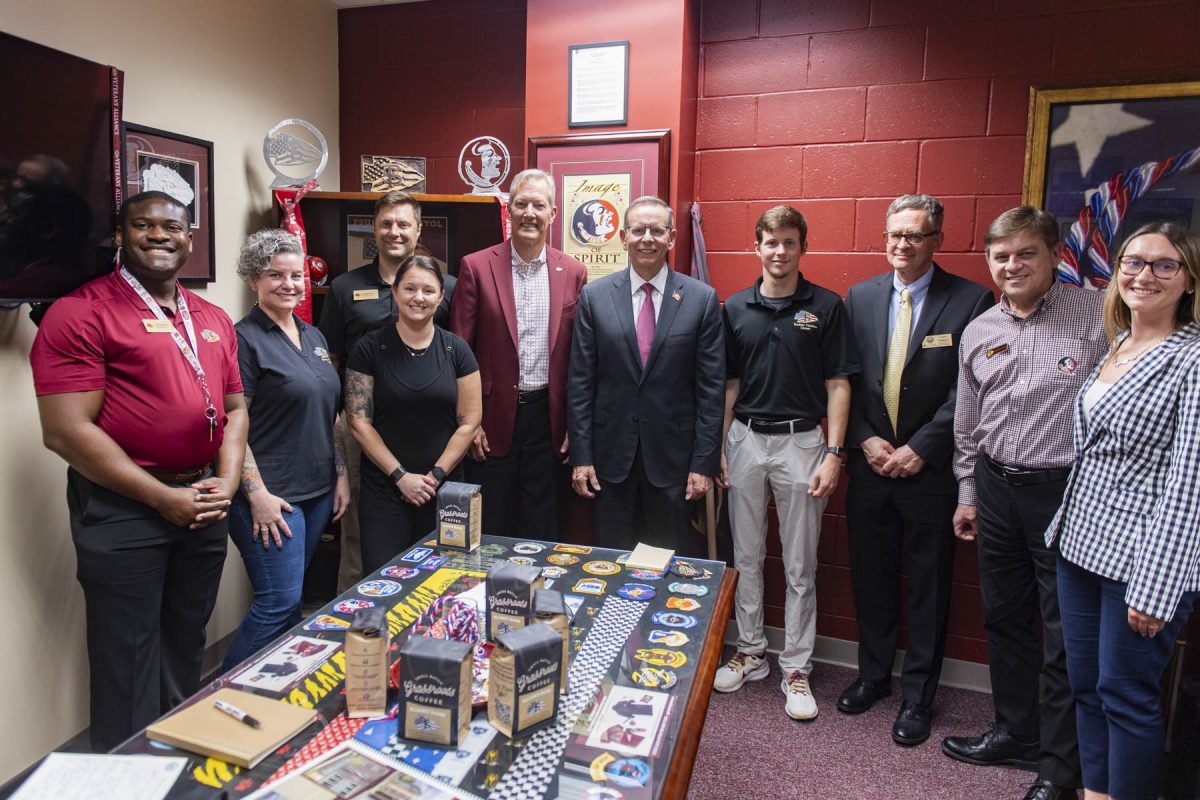 The Deputy Secretary of the U.S. Department of Veterans Affairs Paul R. Lawrence (center) visits with FSU's Student Veterans Center staff on June 24, 2025. (Matthew McConnell/Florida State University)