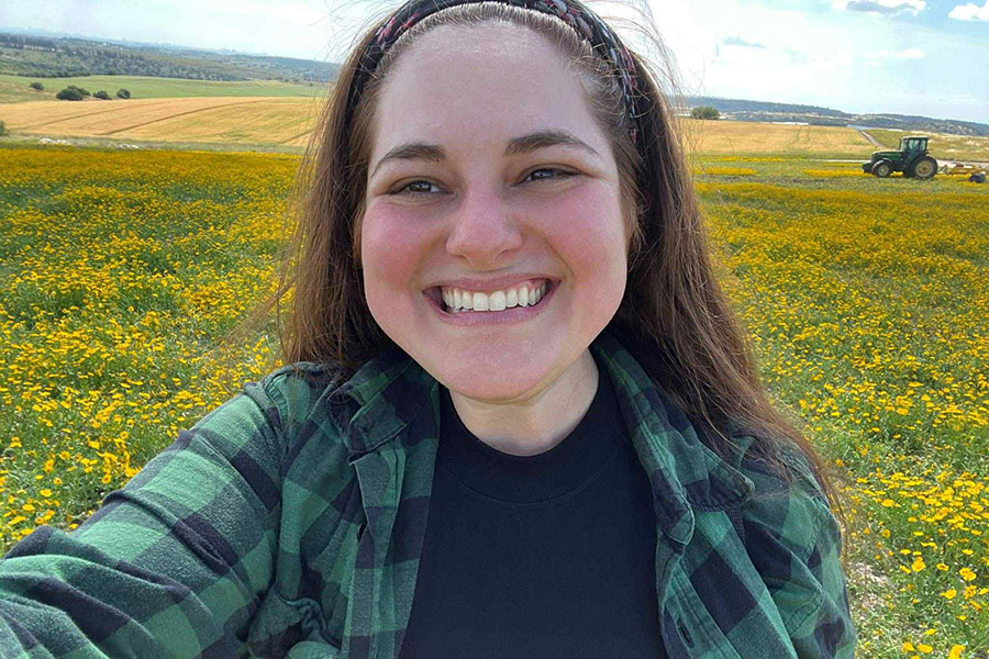 Danielle Wirsansky, a doctoral candidate in the History Department at Florida State University, in a field of wildflowers in the Northern region of Israel. For her Fulbright cultural engagement project, Wirsansky photographed wildflowers across Israel and created a virtual exhibit called “Blooming Against All Odds.” (Danielle Wirsansky)