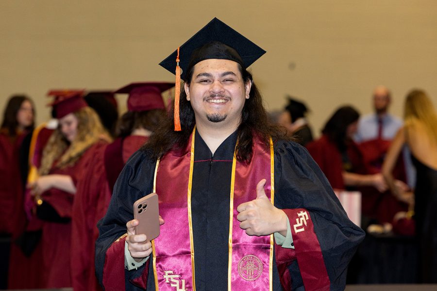 A Florida State University graduate celebrates during one of the summer ceremonies, Friday, Aug. 1, 2025, at the Donald L. Tucker Civic Center. (FSU Photography)
