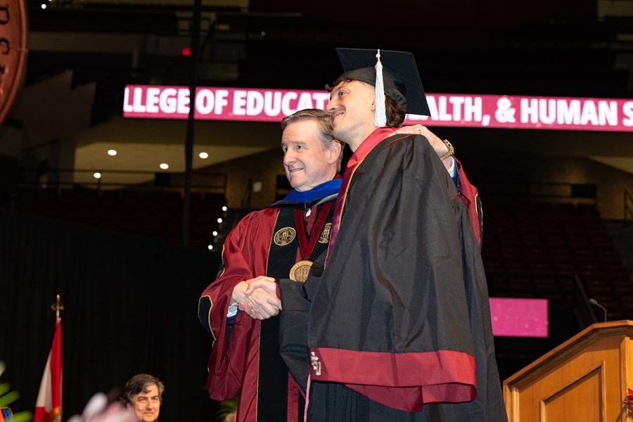 Florida State University President Richard McCullough shakes hands with a graduate during one of the summer commencement ceremonies, Friday, Aug. 1, 2025, at the Donald L. Tucker Civic Center. (FSU Photography)