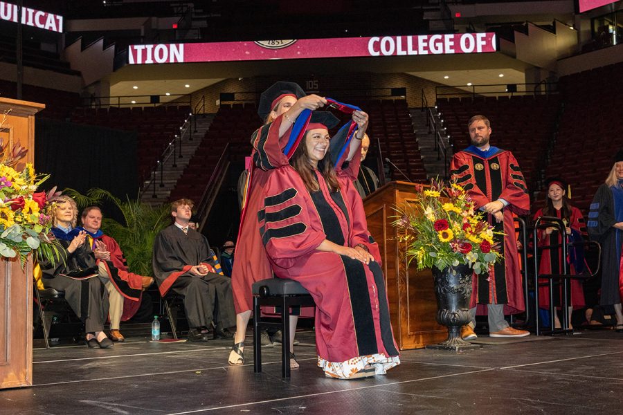 A Florida State University faculty member hoods a graduate during the summer doctoral hooding ceremony, Friday, Aug. 1, 2025, at the Donald L. Tucker Civic Center. (FSU Photography)
