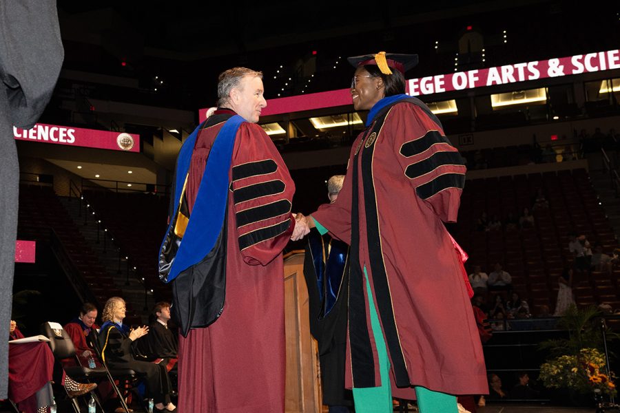 Florida State University President Richard McCullough congratulates a graduate at the university’s summer doctoral hooding ceremony, Friday, Aug. 1, 2025, at the Donald L. Tucker Civic Center. (FSU Photography)