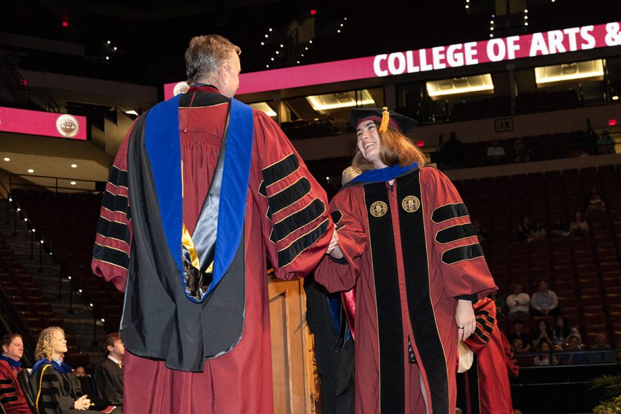Florida State University President Richard McCullough congratulates a graduate at the university’s summer doctoral hooding ceremony, Friday, Aug. 1, 2025, at the Donald L. Tucker Civic Center. (FSU Photography)