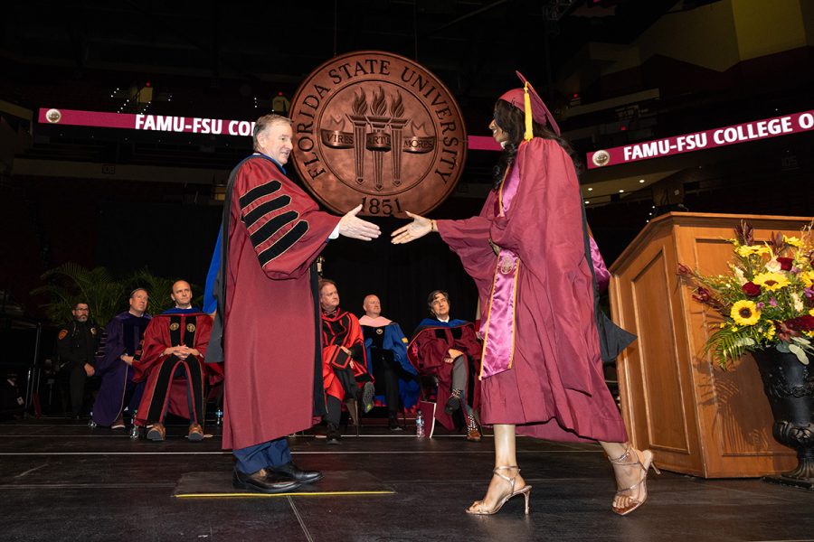 Florida State University President Richard McCullough shakes hands with a graduate during one of the summer commencement ceremonies, Friday, Aug. 1, 2025, at the Donald L. Tucker Civic Center. (FSU Photography)