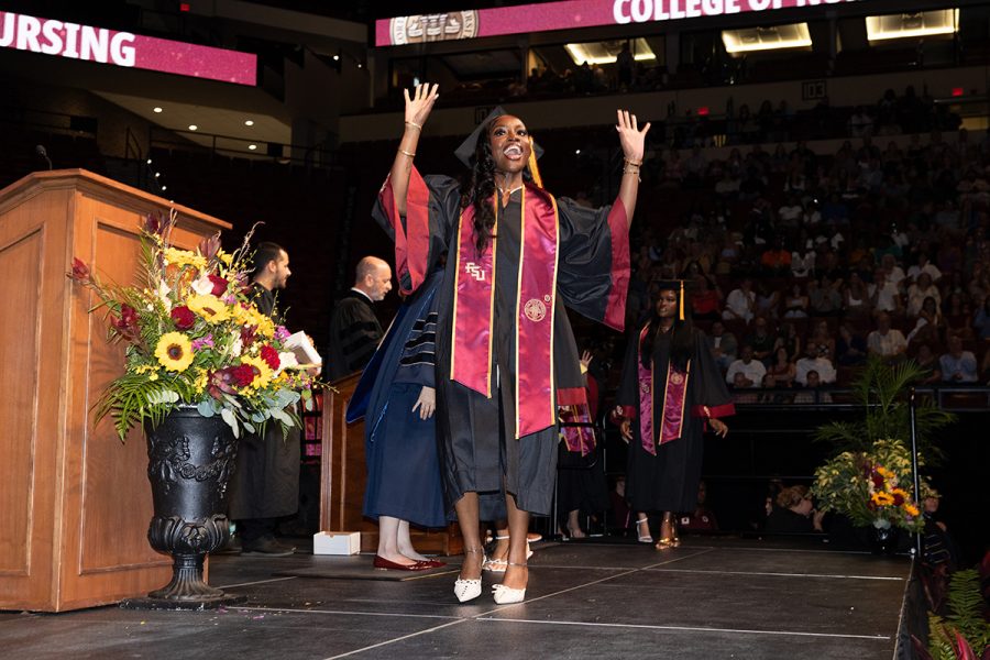 A Florida State University graduate celebrates during one of the summer ceremonies, Friday, Aug. 1, 2025, at the Donald L. Tucker Civic Center. (FSU Photography)