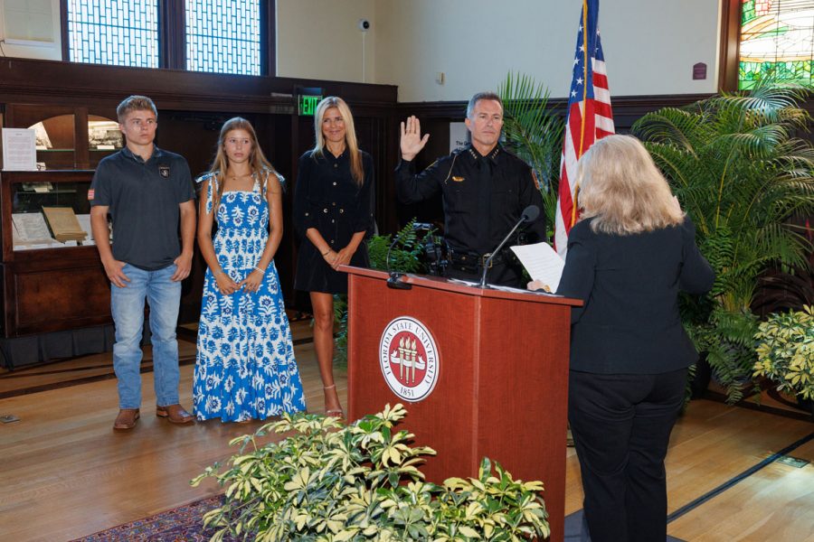 AVP for Public Safety Barbara O'Connor swears in FSUPD Chief of Police Jason Trumbower as his family looks on during a ceremony Tuesday, Aug. 12, 2025, at Dodd Hall. (Bill Lax/FSU Photography)