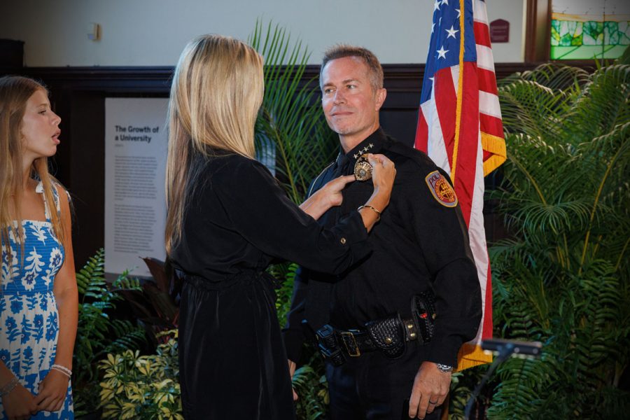 Donna Trumbower pins FSUPD Chief of Police Jason Trumbower at a swearing-in ceremony Tuesday, Aug. 12, 2025, at Dodd Hall. (Bill Lax/FSU Photography)