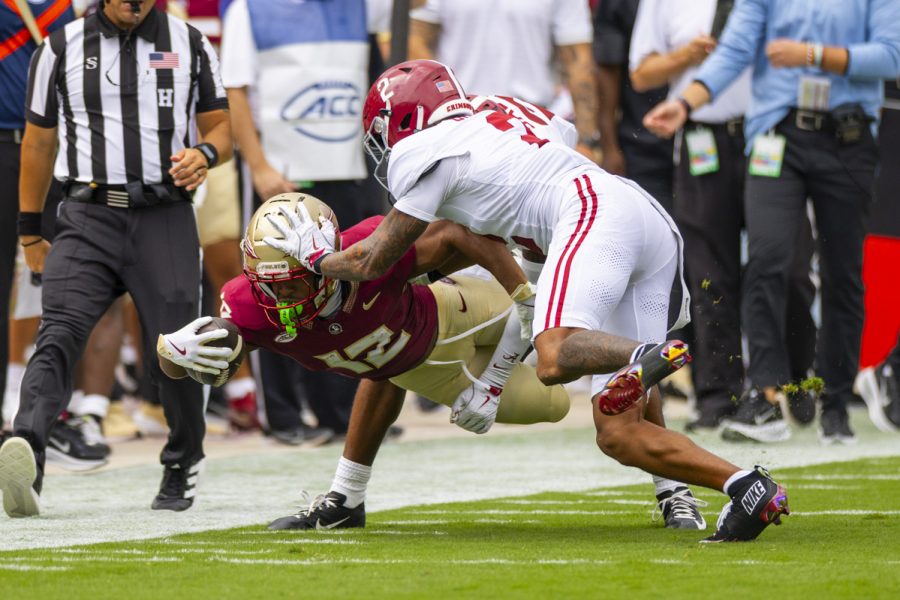 FSU running back Jaylin Lucas dives for a first down during the Florida State Seminoles 31-17 defeat of the Alabama Crimson Tide at Doak Campbell Stadium on August 30, 2025. (Matthew McConnell/Florida State University)