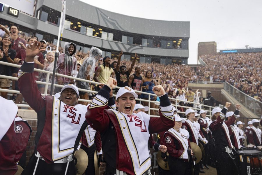 The FSU Marching Chiefs cheer on the Florida State Seminoles in the rain as they take on the Alabama Crimson Tide at Doak Campbell Stadium on August 30, 2025. (Matthew McConnell/Florida State University)