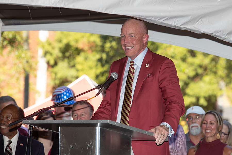 Board of Trustees chair Peter Collins speaks during the groundbreaking for Legacy Hall, the new home of the College of Business, in 2022.