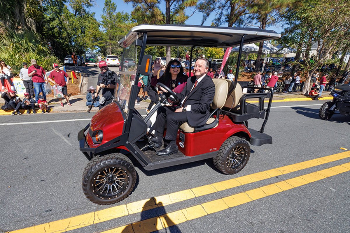 President Richard McCullough and FSU First Lady Jai Vartikar ride in the FSU Homecoming Parade on Oct. 31, 2025. (Bill Lax/FSU Photography)