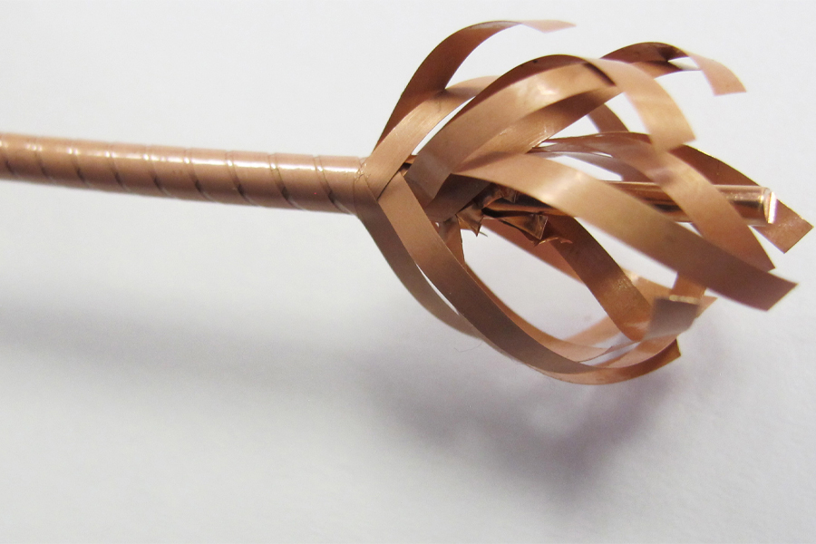 Several bands of superconducting material wound together to form a wire.