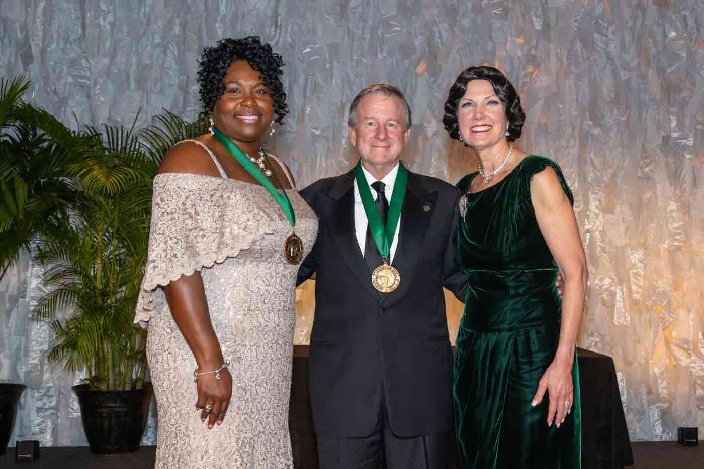 FSU President Richard McCullough stands between University of South Florida Vice President for Research Sylvia Thomas and U.S. Patent & Trademark Office Interim Southeast Regional Outreach Director Elizabeth Dougherty at a ceremony honoring McCullough and others as 2025 inductees of the Florida Inventors Hall of Fame.
