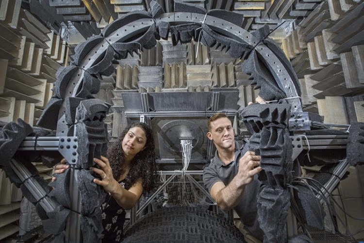 Two people work in a soundproof room.