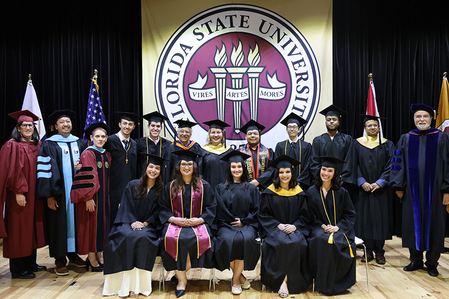 The FSU Panama Class of 2025 with members of the platform party during FSU Panama's commencement ceremony Dec. 3 at the City of Knowledge Convention Center in Panama City, Republic of Panama. (Valeria Tovar/FSU Panama)