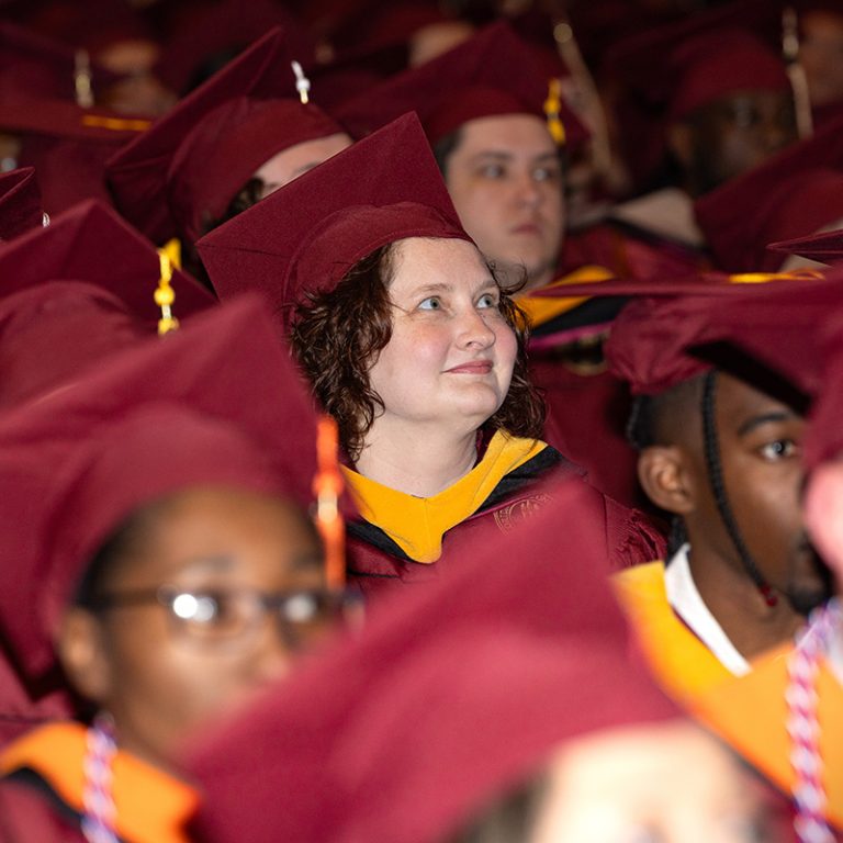 A Florida State University graduate smiles during one of the fall commencement ceremonies Friday, Dec. 12, 2025, at the Donald L. Tucker Civic Center. (Bill Lax/ Florida State University)