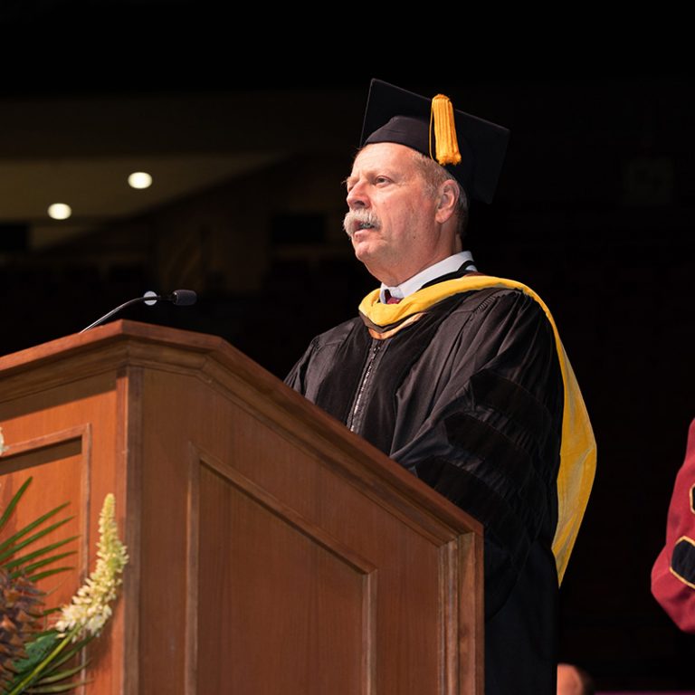 Stephen McDowell, assistant provost and interim dean of The Graduate School, confers graduate degrees during fall commencement on Friday, Dec. 12, 2025, at the Donald L. Tucker Civic Center. (Bill Lax/ Florida State University)