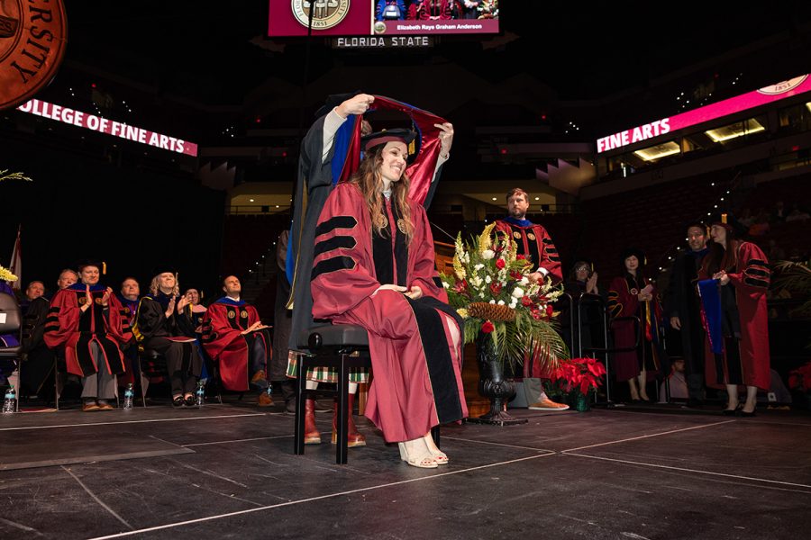 A Florida State University faculty member hoods a graduate during the summer doctoral hooding ceremony, Friday, Dec. 12, 2025, at the Donald L. Tucker Civic Center. (Bill Lax/ Florida State University)