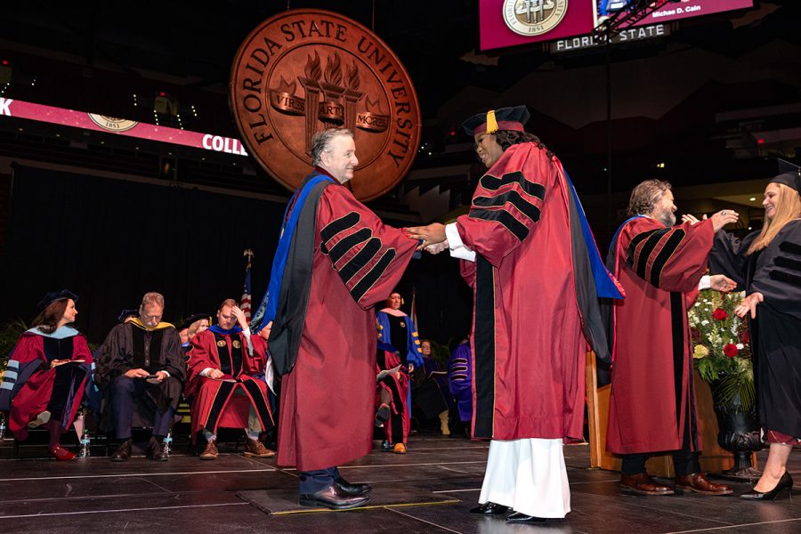 Florida State University President Richard McCullough congratulates a graduate during the fall 2025 commencement ceremony, held Friday, Dec. 12, 2025, at the Donald L. Tucker Civic Center. (Bill Lax/ Florida State University)