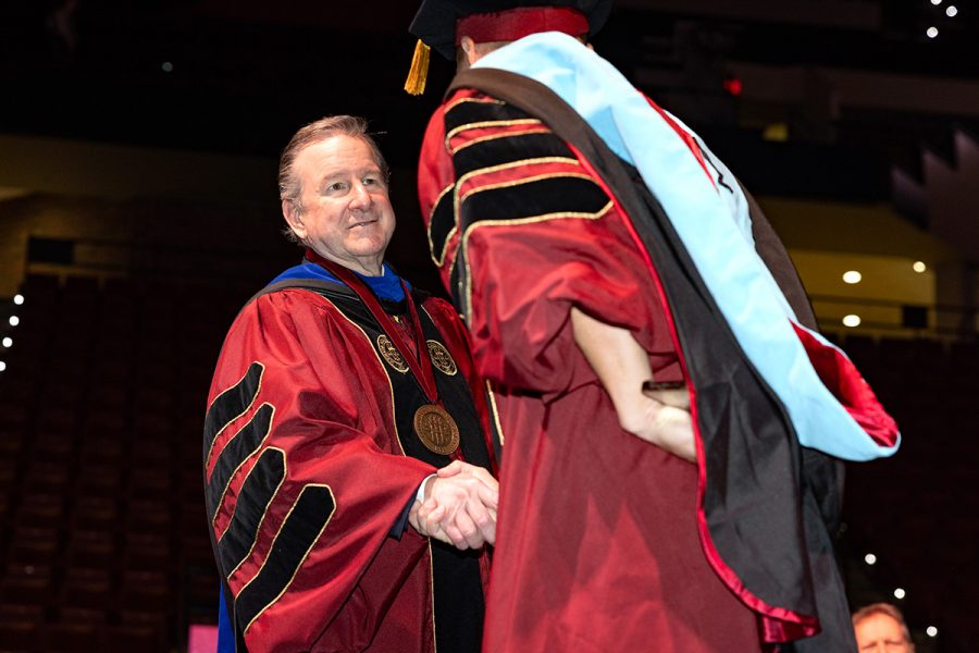 Florida State University President Richard McCullough congratulates a graduate during the fall 2025 commencement ceremony, held Friday, Dec. 12, 2025, at the Donald L. Tucker Civic Center. (Bill Lax/ Florida State University)