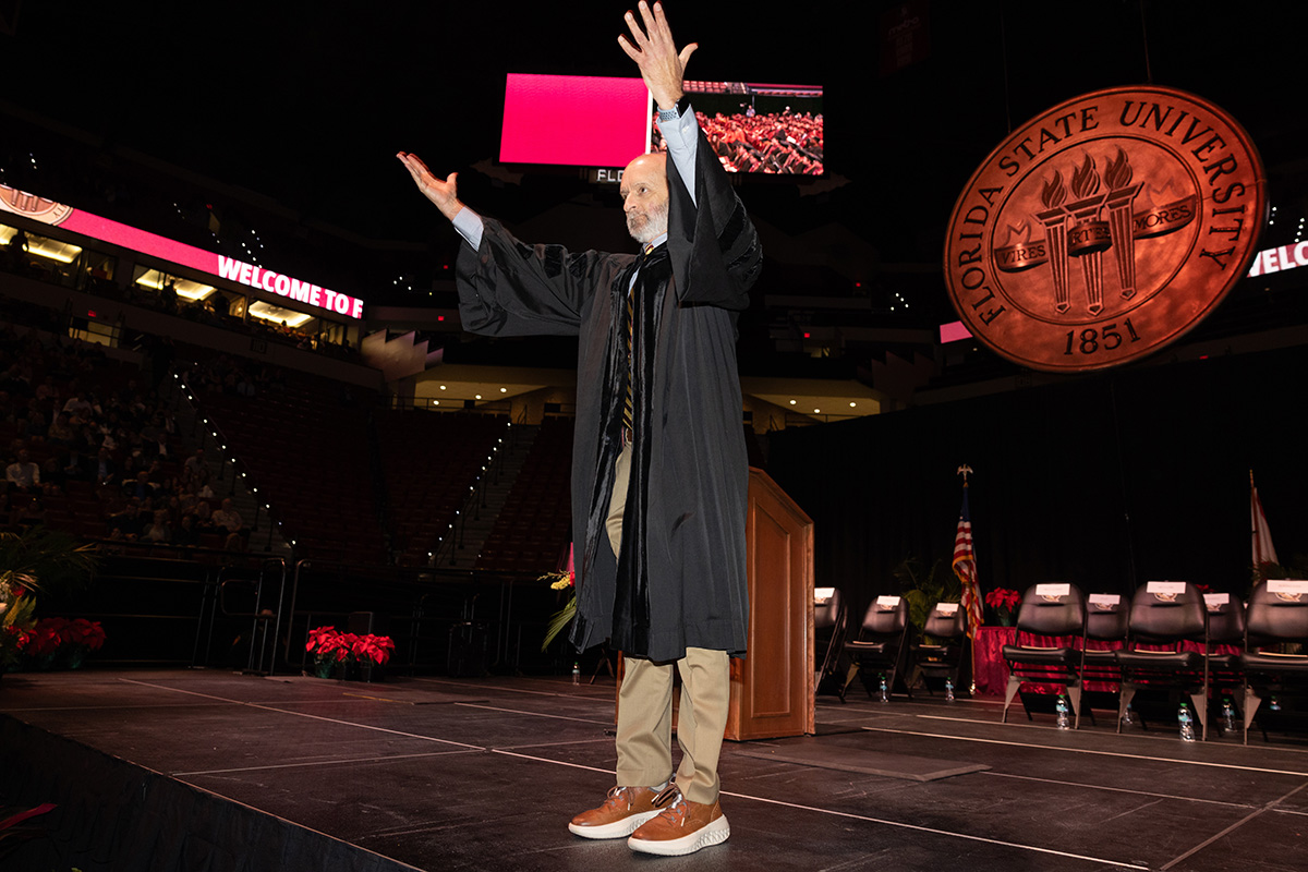 Mark Zeigler, teaching professor in the School of Communication celebrates with graduates during fall commencement Friday, Dec. 12, 2025, at the Donald L. Tucker Civic Center. (Bill Lax/ Florida State University)