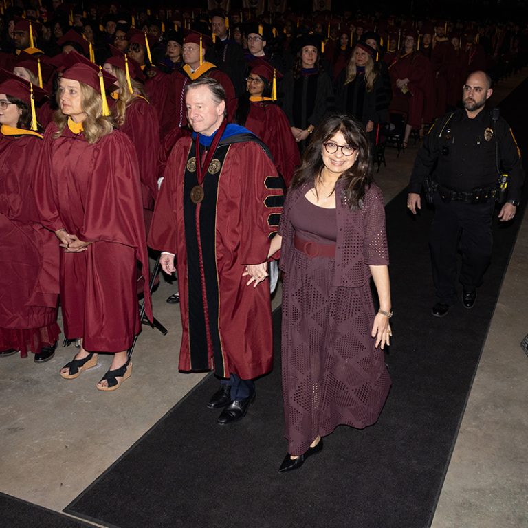 Florida State University President Richard McCullough and FSU First Lady Dr. Jai Vartikar walk into fall commencement Friday, Dec. 12, 2025, at the Donald L. Tucker Civic Center. (Bill Lax/ Florida State University)