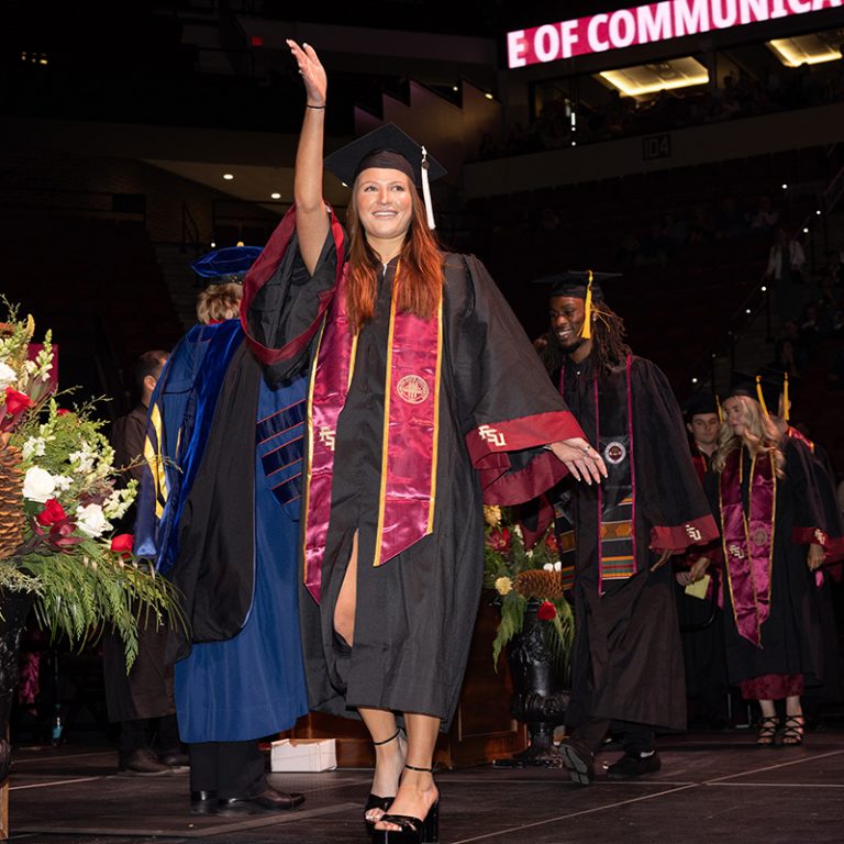 A graduate walks across the stage during Florida State University’s fall 2025 commencement ceremony, held Friday, Dec. 12, 2025, at the Donald L. Tucker Civic Center. (Bill Lax/ Florida State University)