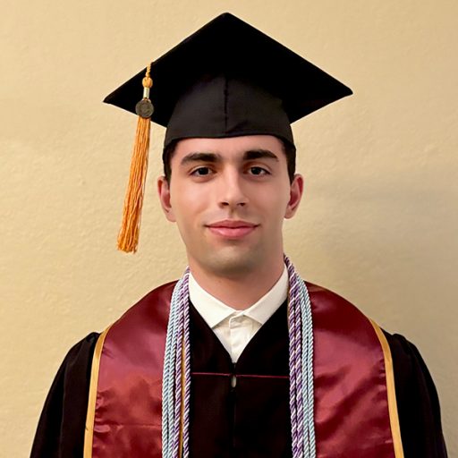 Headshot of Nicolas Monteagudo in his graduation cap and gown.