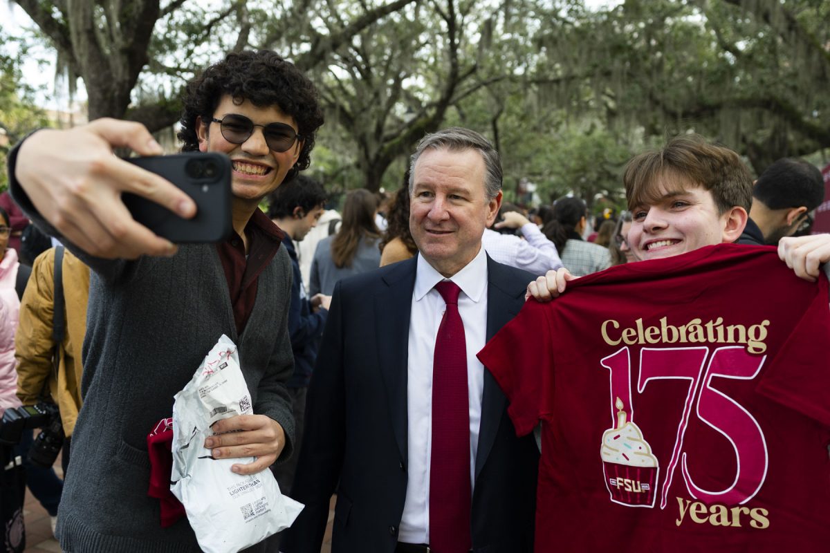 Florida State University President Richard McCullough poses for a photo with students on legacy walk during the university’s 175th birthday party on January 21, 2026. Photo by Matthew McConnell/Florida State University