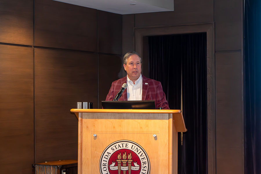 Tim Chapin, dean of the College of Social Sciences and Public Policy, delivers remarks during a graduation ceremony for recipients of the Global Citizenship Certificate Friday, Dec. 5, at the Globe Auditorium. (Jalisa Redding/Center for Global Engagement)