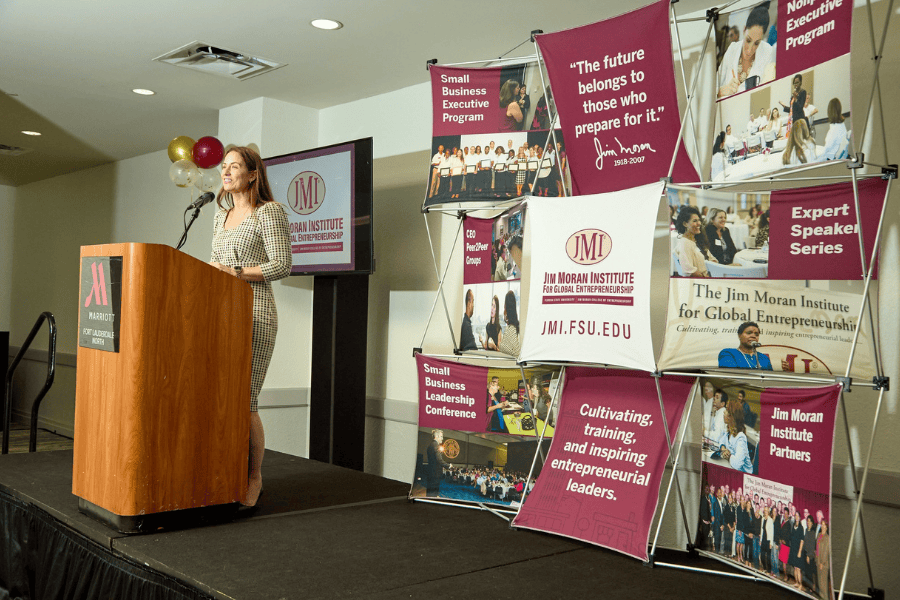 Jennifer Kovach, director of the Jim Moran Institute’s South Florida region, speaks at the JMI South Florida Fall 2025 Executive Programs graduation. (Photo by David I. Muir/Island Syndicate)