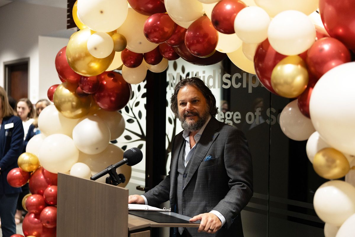 David Springer, dean of the College of Social Work, shares his enthusiasm for the renovated Maryland Building during its grand opening ceremony. (Logan Lowery/Florida State University)