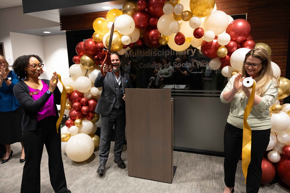 David Springer, Lisa Magruder and Shannon Bennett participate in the official ribbon cutting of the Maryland Building. (Logan Lowery/Florida State University)