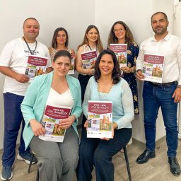 Vilma Fuentes (front right) and ASUE faculty with the COIL handbook they developed. (Vilma Fuentes/LSI)