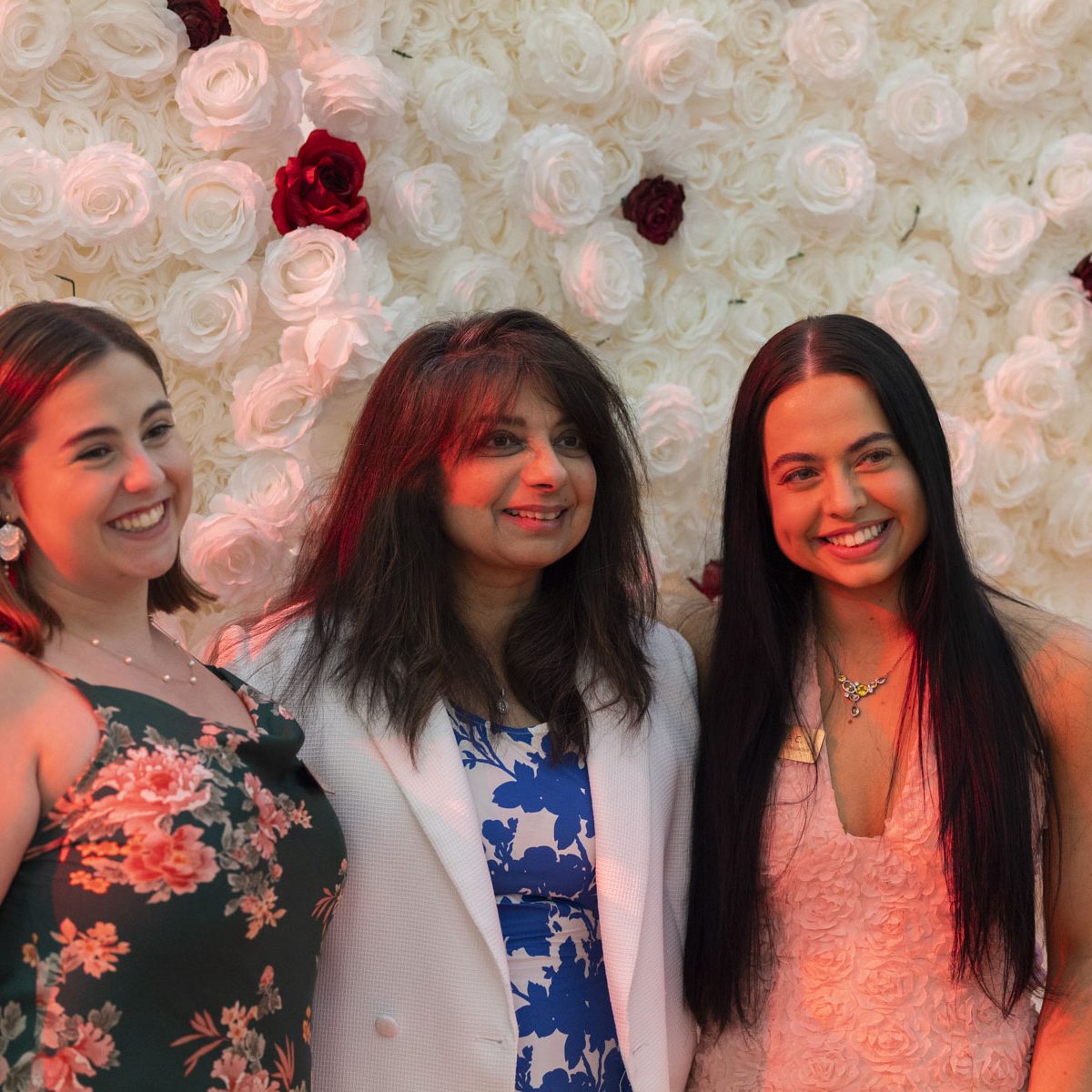 three people take a group photo