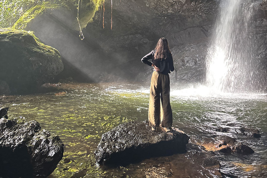 Amelia Rivers, a recent graduate of the College of Music, visiting “La Cueva del Esplendor,” a waterfall located outside of Jardín, Colombia. (Amelia Rivers)