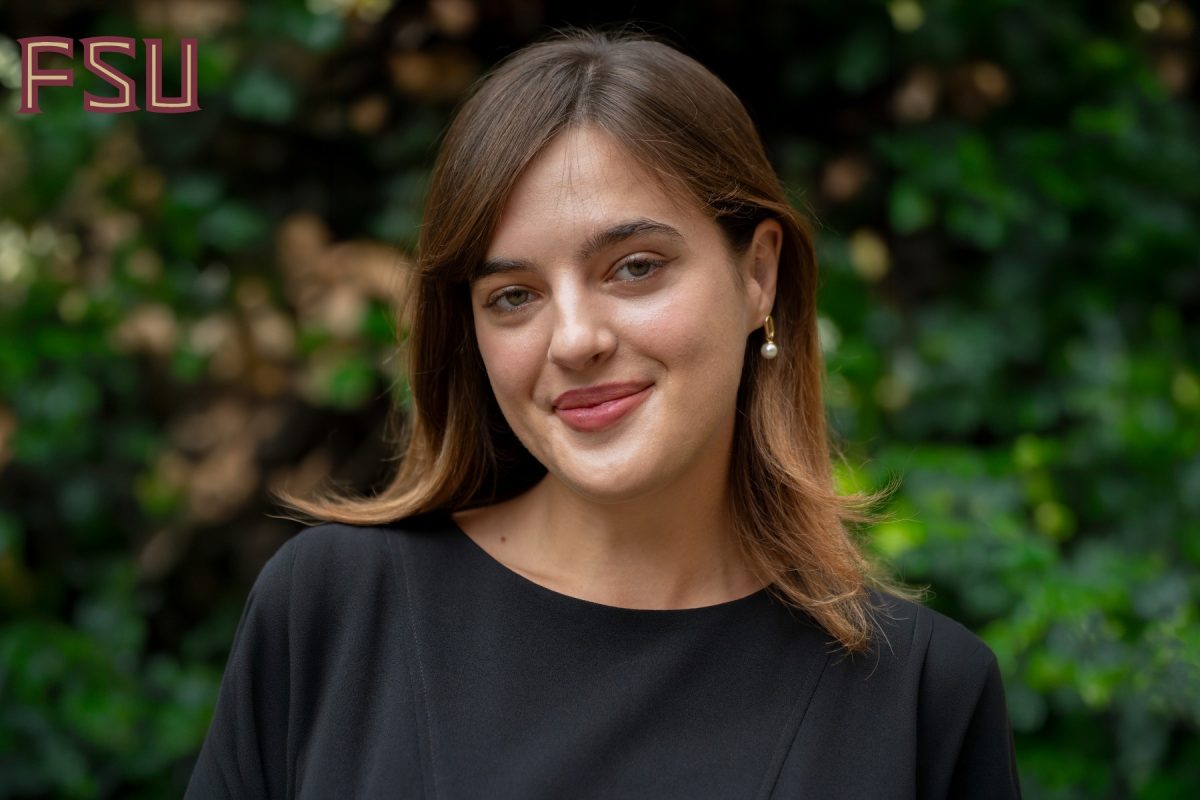 Ella Garcia headshot in front of greenery