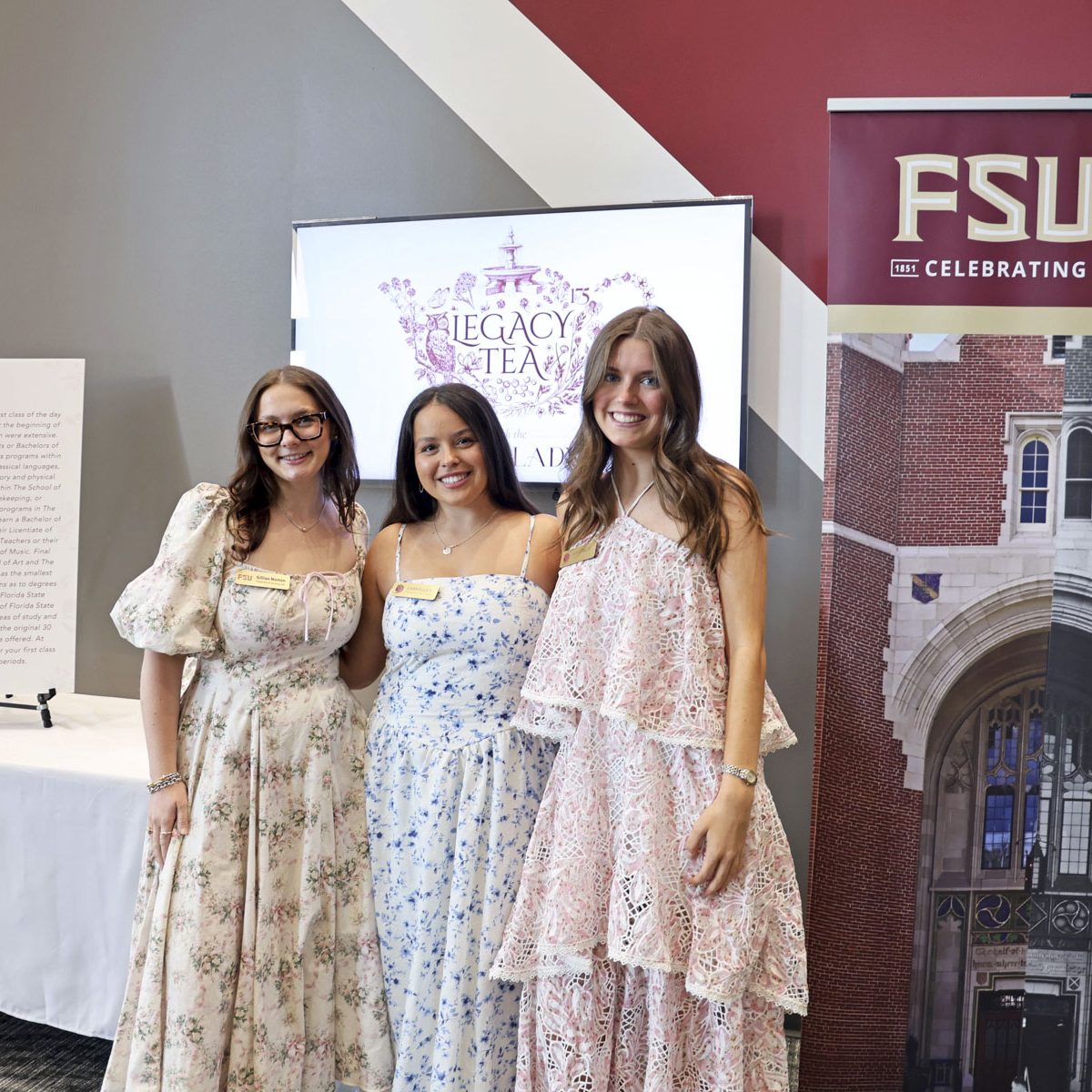 three female students pose for a group photo