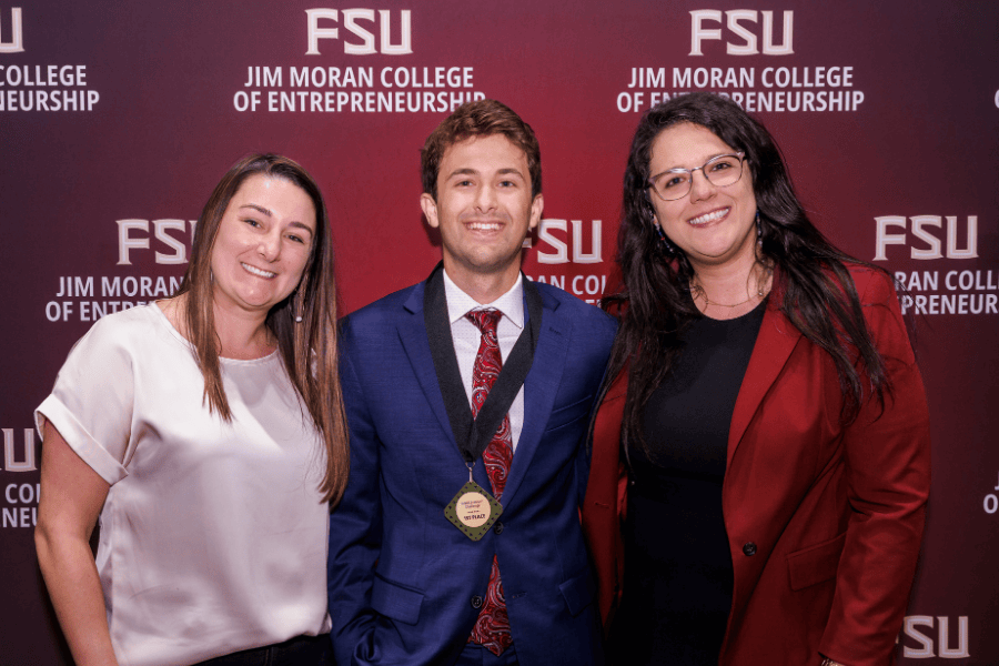 Pictured left to right: Jim Moran College of Entrepreneurship Assistant Dean of Academic and Student Services Kirsten Harrison; InNOLEvation Challenge winner Jacob Tarantelli, founder of Padly; and Assistant Professor of Entrepreneurship Juliana Binhote. (Colin Hackley Photography)