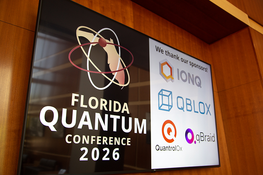 A sign announced the Florida Quantum Conference and its sponsors.