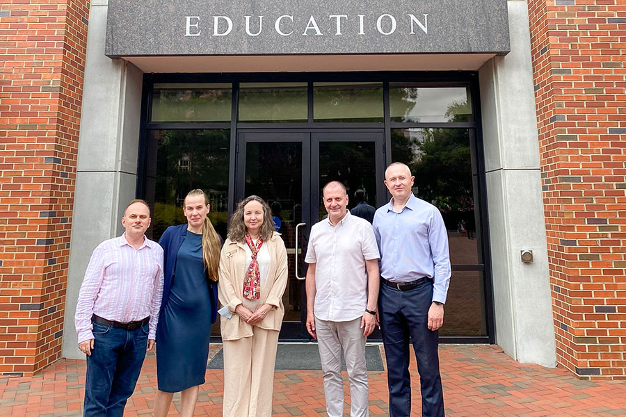 (Left to right) BridgeUSA Fellows Taras Panchenko and Nataliia Safonova with Dina Vyortkina, assistant dean for Innovation and Instructional Technology Enhancement at Anne's College, and BridgeUSA Fellows Andrii Roskalda and Andrii Balendr outside of the Stone Building on FSU's campus. (Learning Systems Institute)