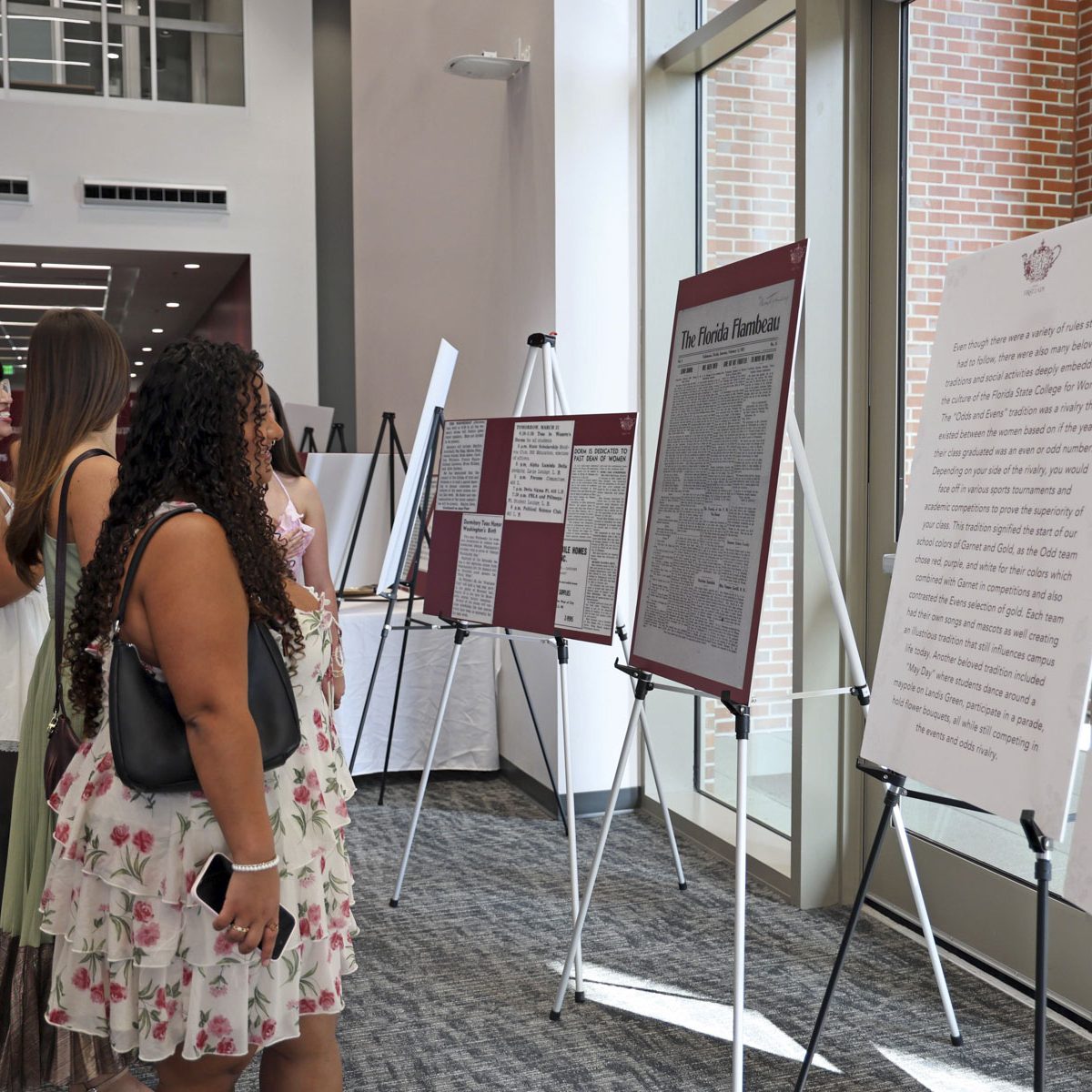 student reading a poster