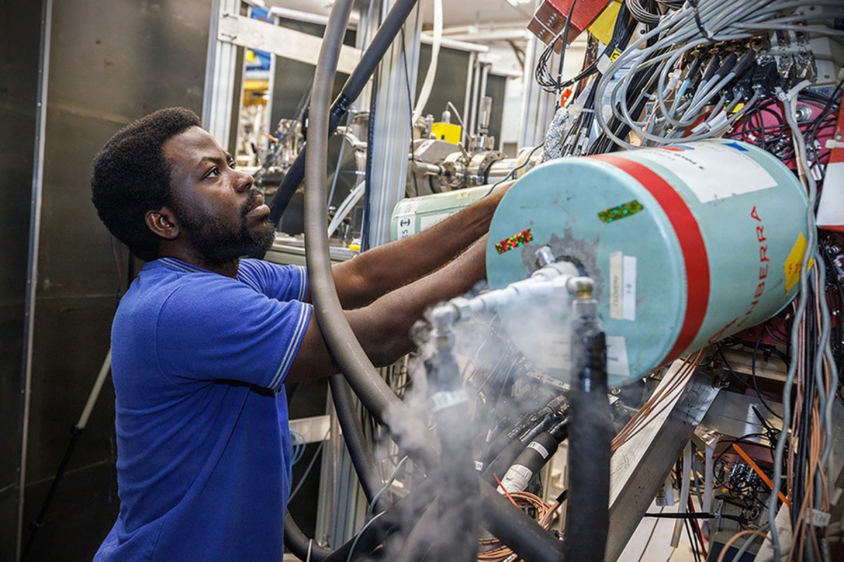 Samuel Ajayi checks the high-resolution gamma-ray detectors of CLARION2 at FSU's John D. Fox Superconducting Linear Accelerator Laboratory.