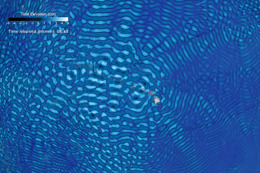 Visualization of ocean tidal elevation showing ripple-like patterns in shades of blue around the Hawaiian islands.