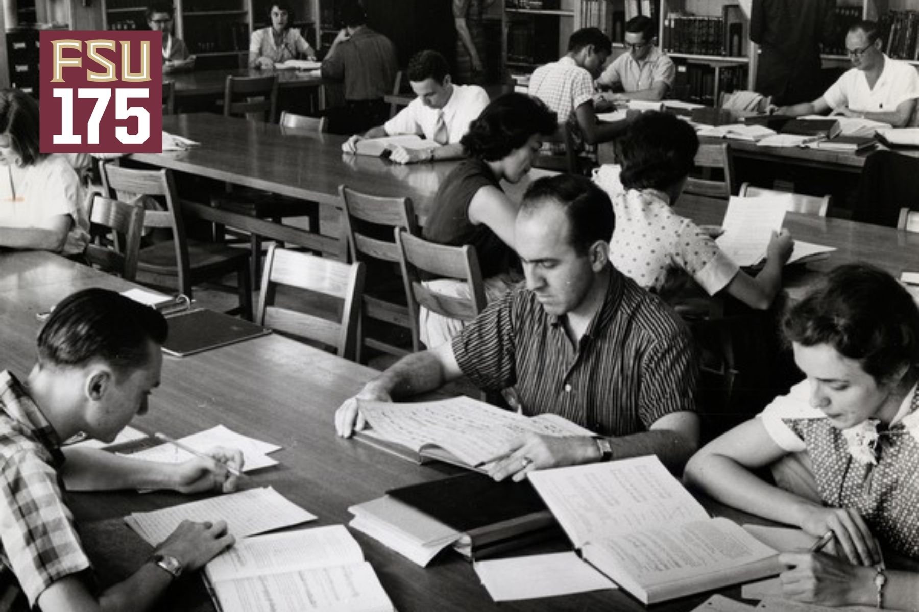A black-and-white vintage photograph of college students sitting at wooden tables in a library, studying books and writing notes, with an "FSU 175" logo in the top-left corner.