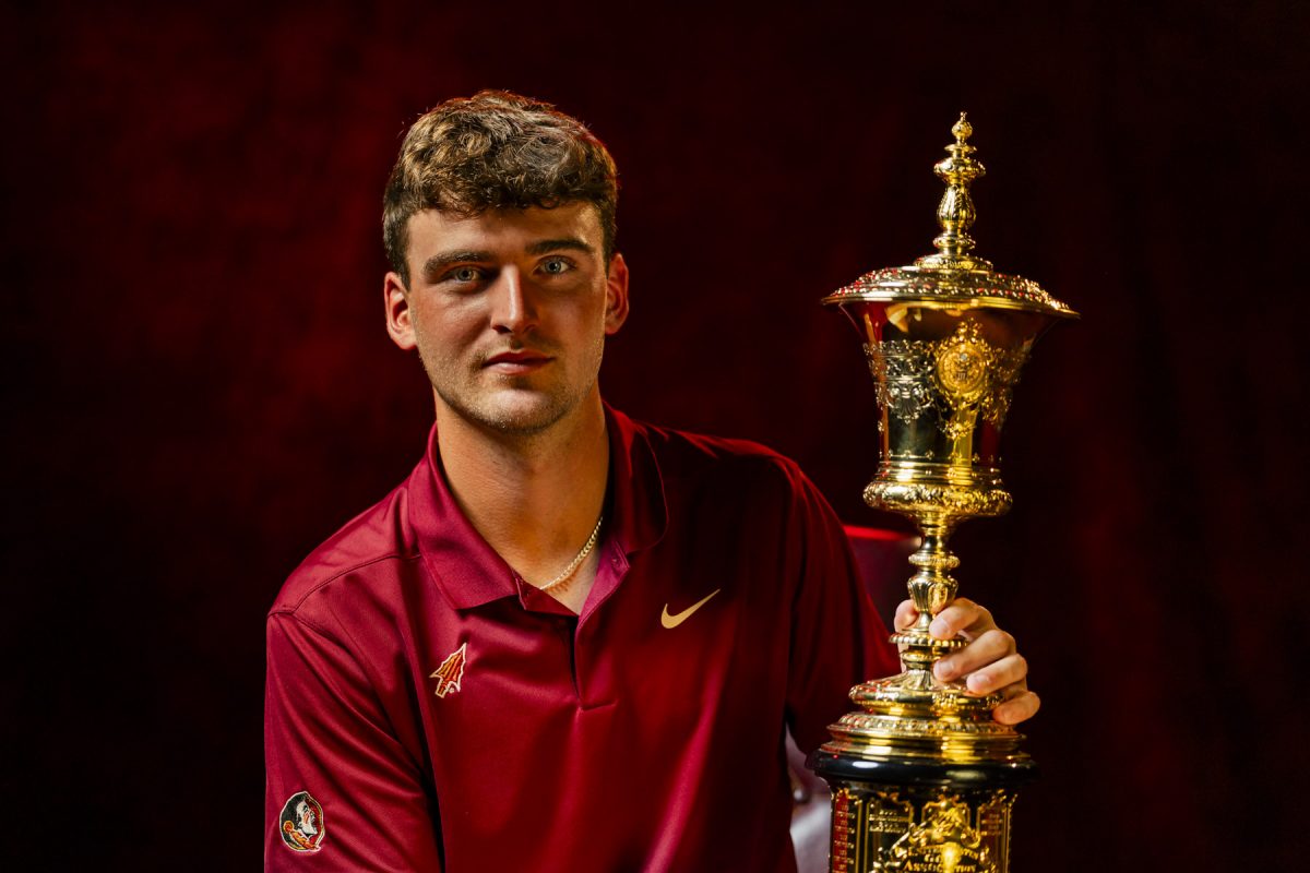 Portrait of Jack Whaley with the Havemeyer Trophy