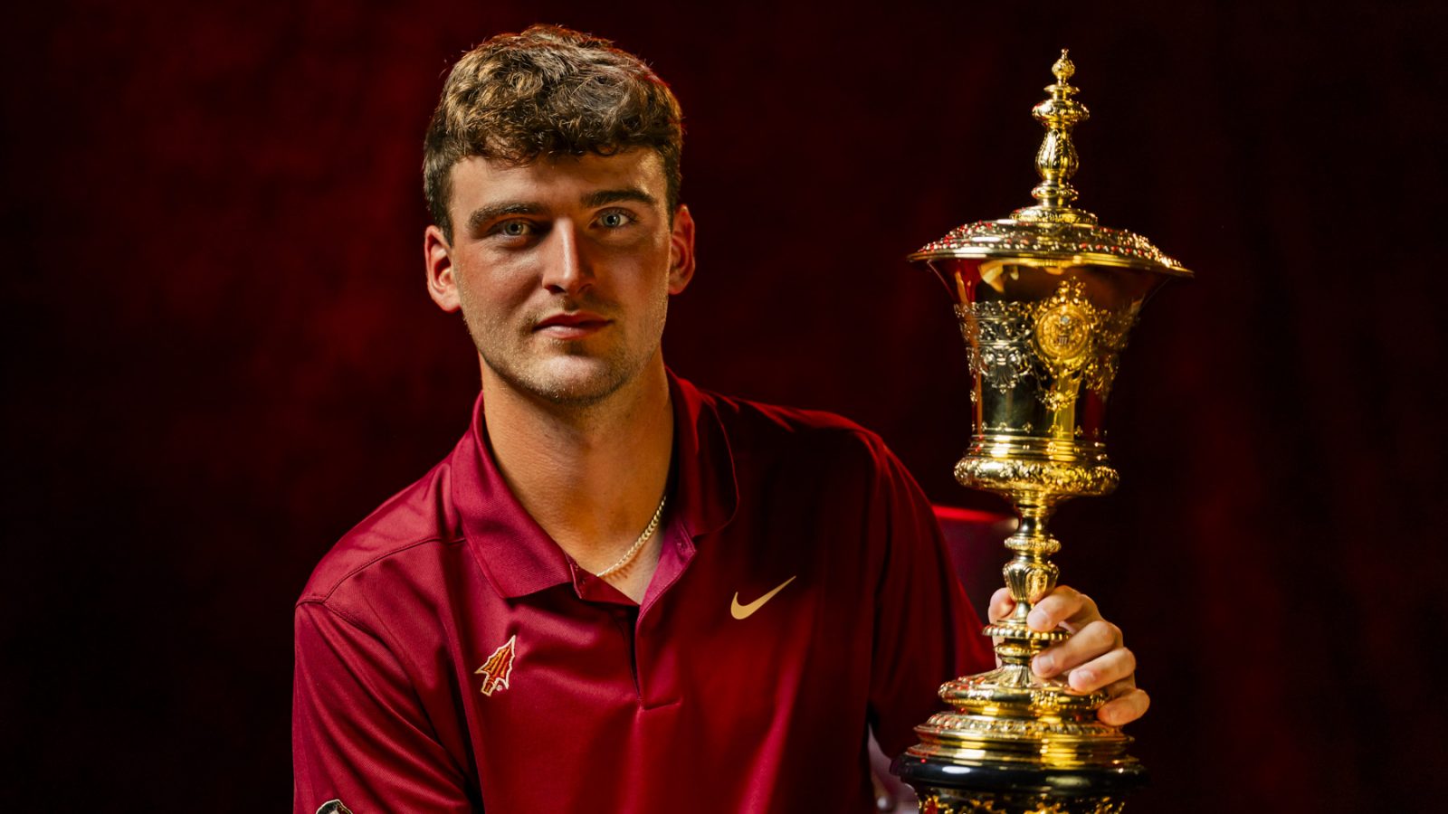 Portrait of Jack Whaley with the Havemeyer Trophy