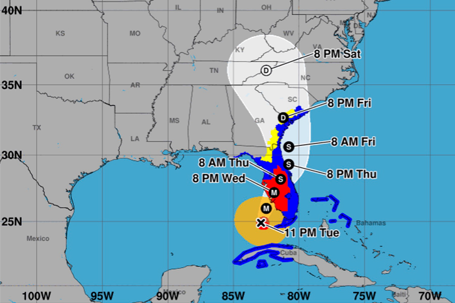 A National Hurricane Center forecast map showing a hurricane southwest of Florida with a projected path moving north across Florida, then northeast along the coasts of Georgia and South Carolina. A white forecast cone indicates the probable path of the storm center through Saturday. Colored hurricane and tropical storm watches and warnings are displayed along portions of Florida, Georgia and South Carolina.