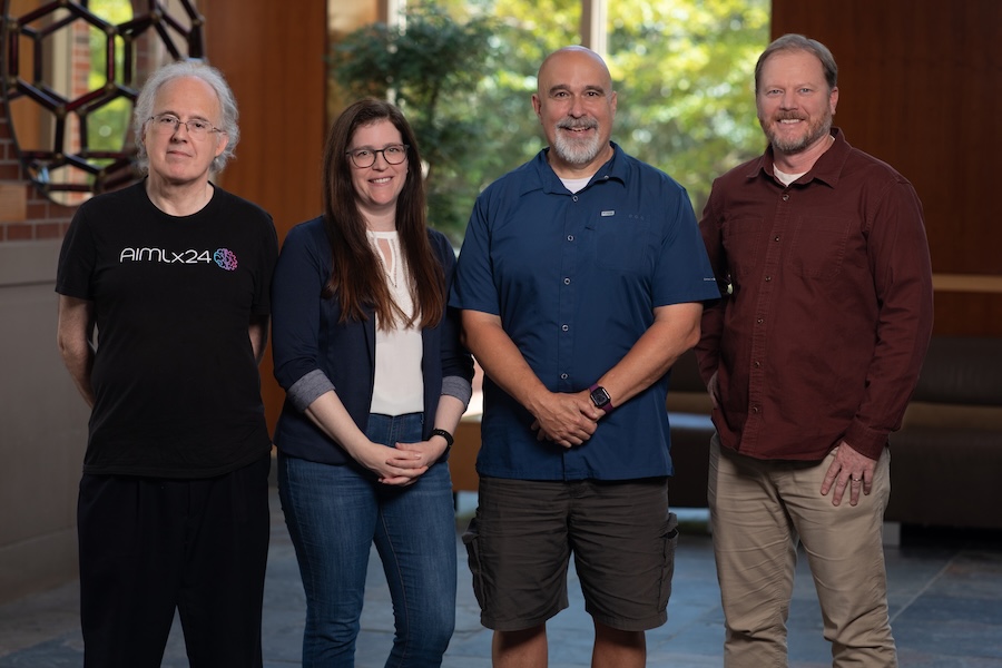 The four FSU IDEAL-Math researchers stand and pose for a photo.