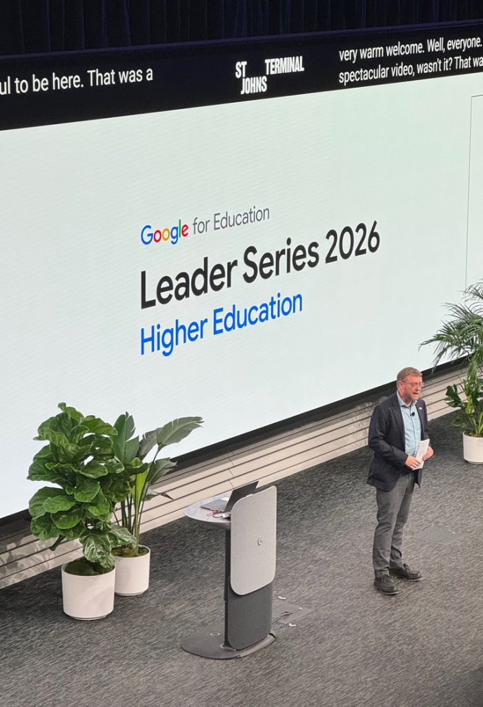 Paul Marty stands on Google's stage as he gives a presentation.